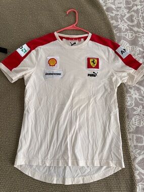 Puma Tacing. Off White Short Sleeve Team Shirt with Red Shoulder Panels